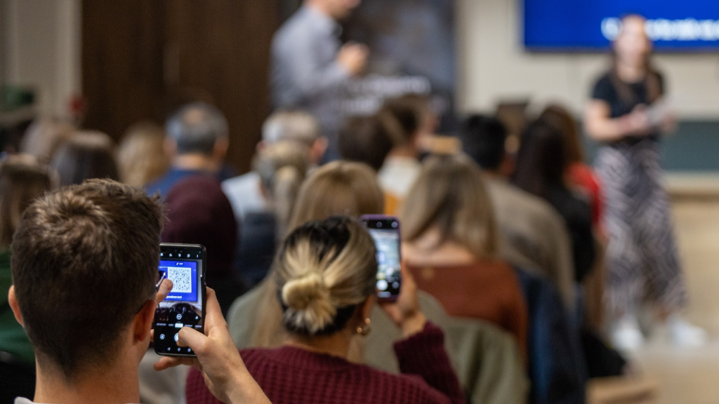 Audience members listening and engaging during a Lion and Mason event