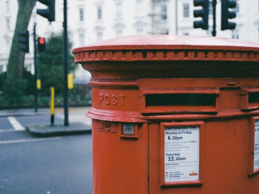 Close-up photograph of a red Royal Mail post box