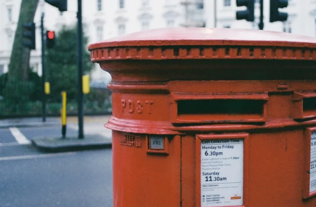 Close-up photograph of a red Royal Mail post box
