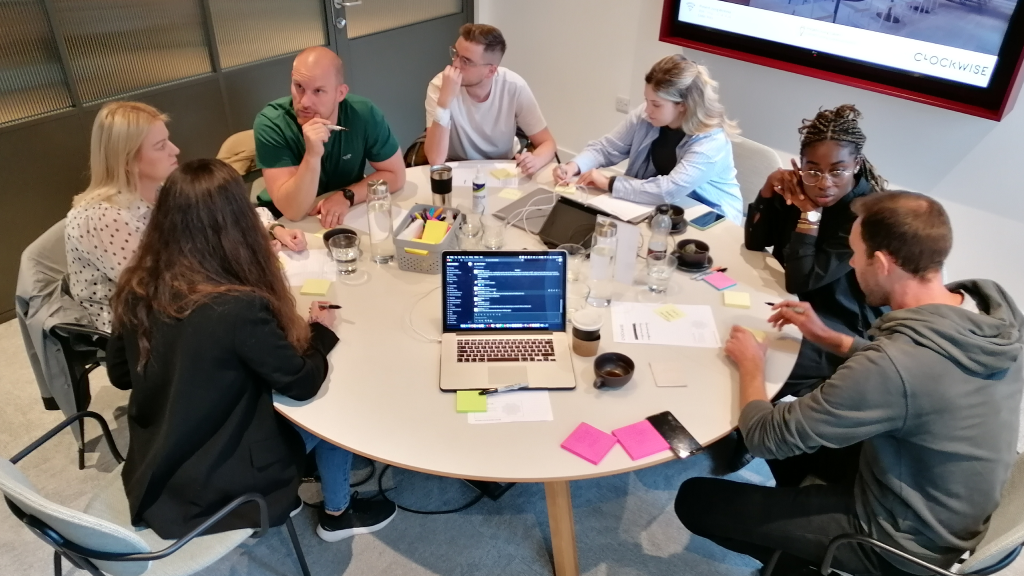 Lion and Mason team members discussing ideas and planning during a strategy workshop