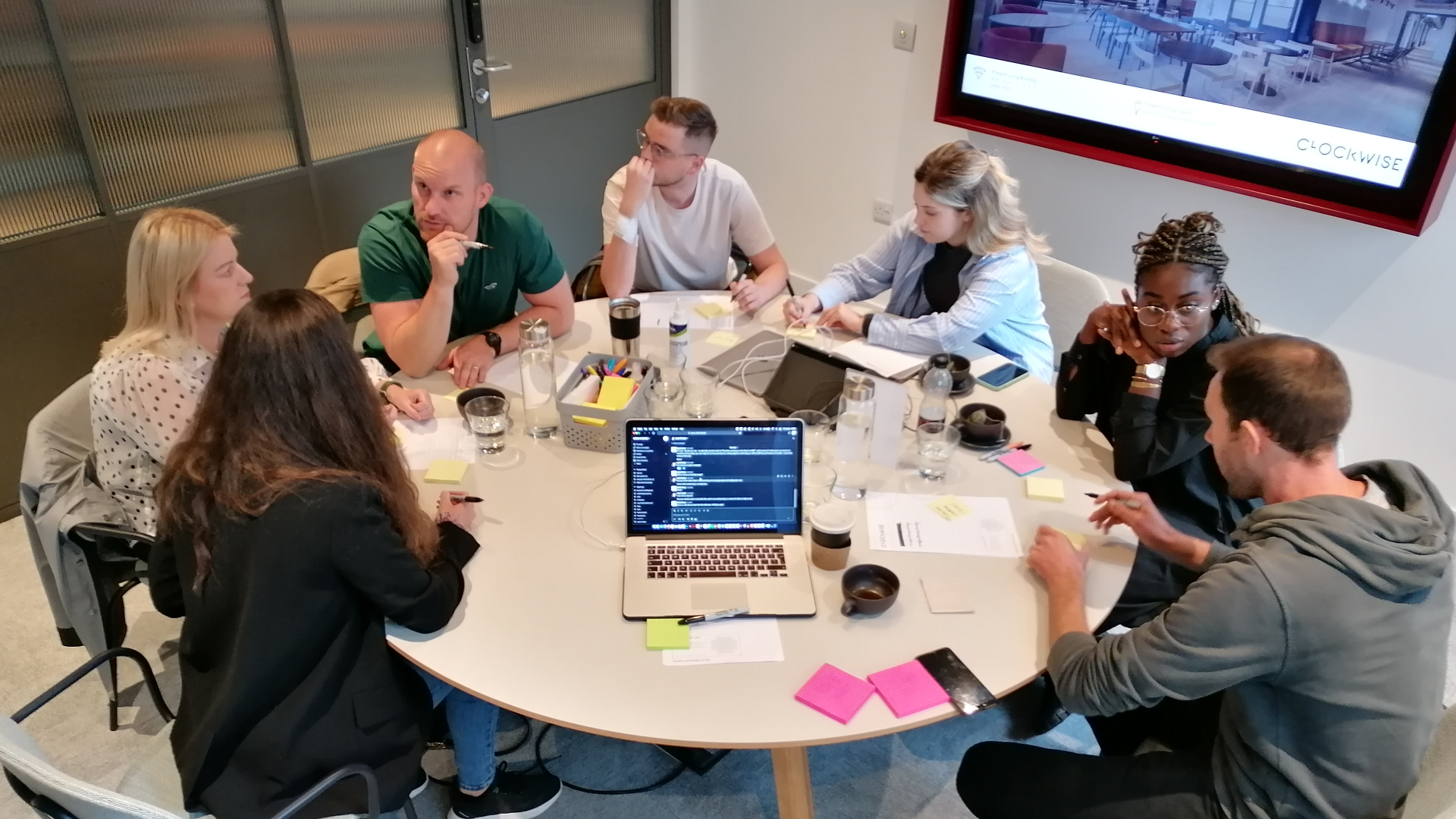 Team workshop with sticky notes on a whiteboard