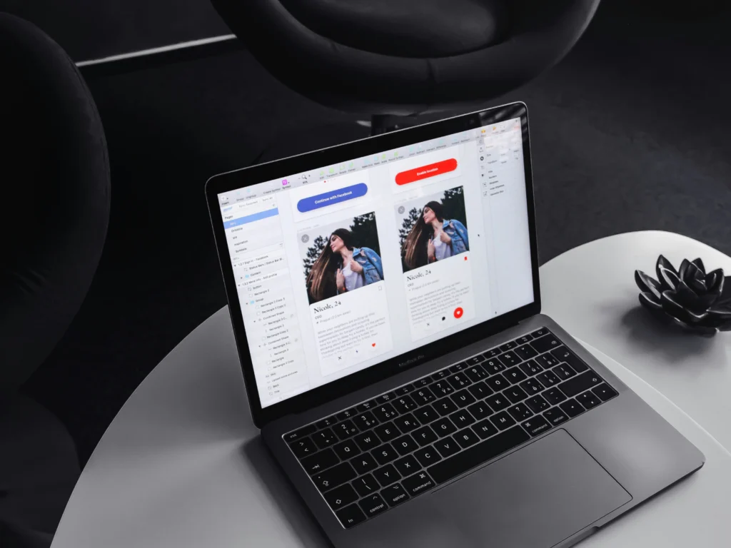 MacBook showing card UI designs