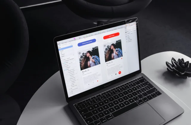 MacBook showing card UI designs