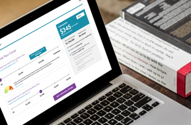 MacBook showing insurance quote and buy screens